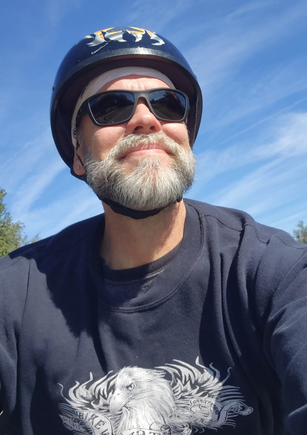Riding a motorcycle under a clear blue sky, calm and reflective, creating space to reset and return to myself