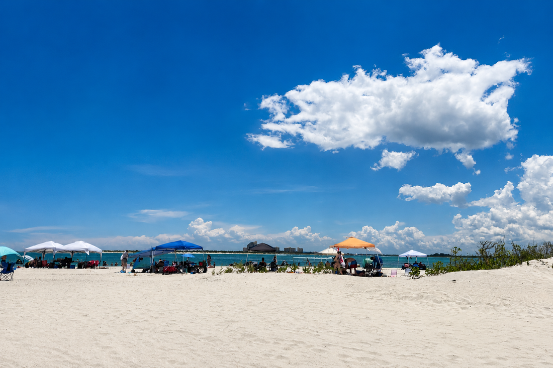 Families enjoying a sunny Fourth of July at Ponce Inlet, Florida, beneath a wide blue sky, capturing a peaceful day of celebration, community, and the quiet beauty of intentional living.