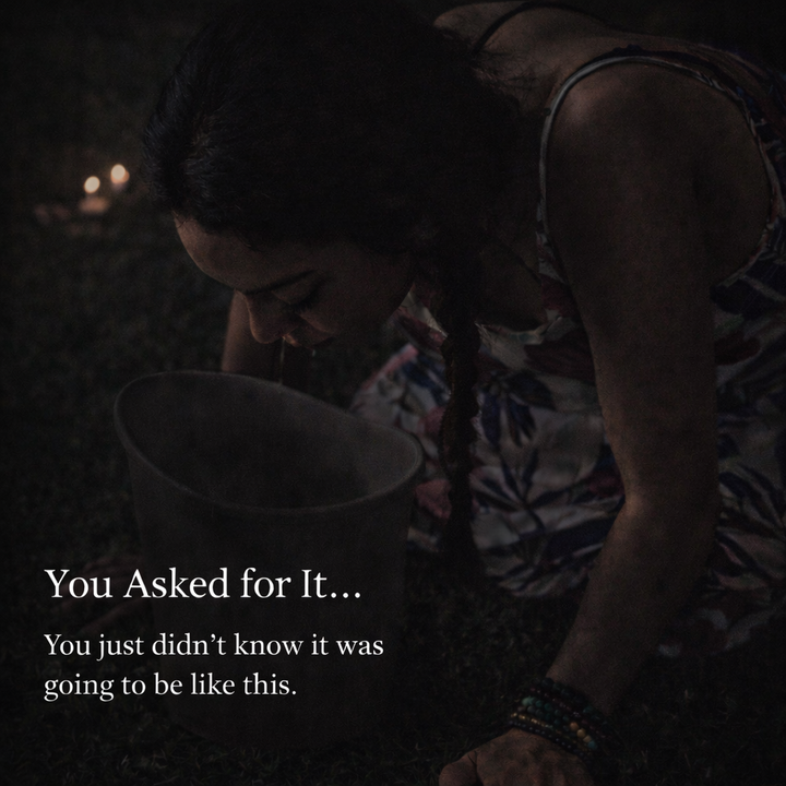 Woman in a dimly lit outdoor ceremony leaning over a bucket during an intense Kambo experience, capturing a raw moment of physical and emotional release with the text “You Asked for It… You just didn’t know it was going to be like this.”